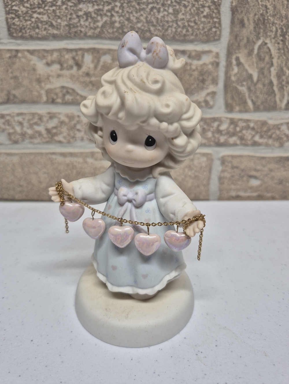 Precious Moments Porcelain Figurine with Pink Heart Charms